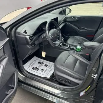Spotless hand-detailed car interior with leather seats